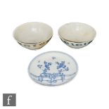 Two Chinese Tek Sing tea bowls circa 1820s, decorated with blue and white banded dot pattern,