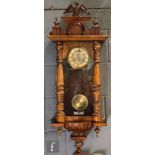 A 19th Century Vienna walnut cased regulator wall clock, the eight day striking movement enclosed by