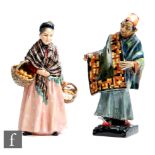 Two Royal Doulton figures comprising The Orange Lady HN1759 and the Carpet Seller HN1464, A/F. (2)