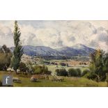 MAURICE KENT (CONTEMPORARY) - Sheep in a meadow with hills beyond, watercolour, signed and dated '