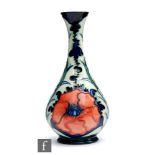 A Moorcroft Pottery vase decorated in the New Poppy pattern designed by Rachel Bishop, impressed