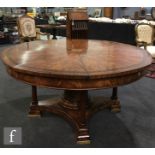 An early 21st Century contemporary mahogany replica of a 'Jupe' radial extending circular dining