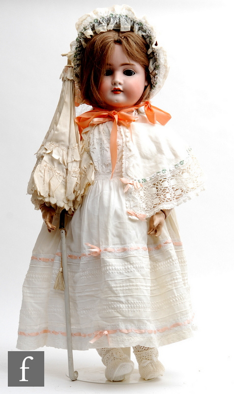 An early 20th Century Schoenau and Hoffmeister bisque socket head doll, child dolly face mould 1906,