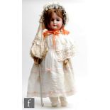 An early 20th Century Schoenau and Hoffmeister bisque socket head doll, child dolly face mould 1906,