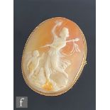 A 9ct hallmarked oval cameo brooch study of a standing Classical maiden with a putti in