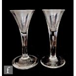 An 18th Century drinking glass circa 1740, the drawn trumpet bowl above a plain stem with an