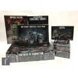 Eight Warhammer 40,000 sets, comprising Fortress of Redemption, Imperial Bastion, Militarum