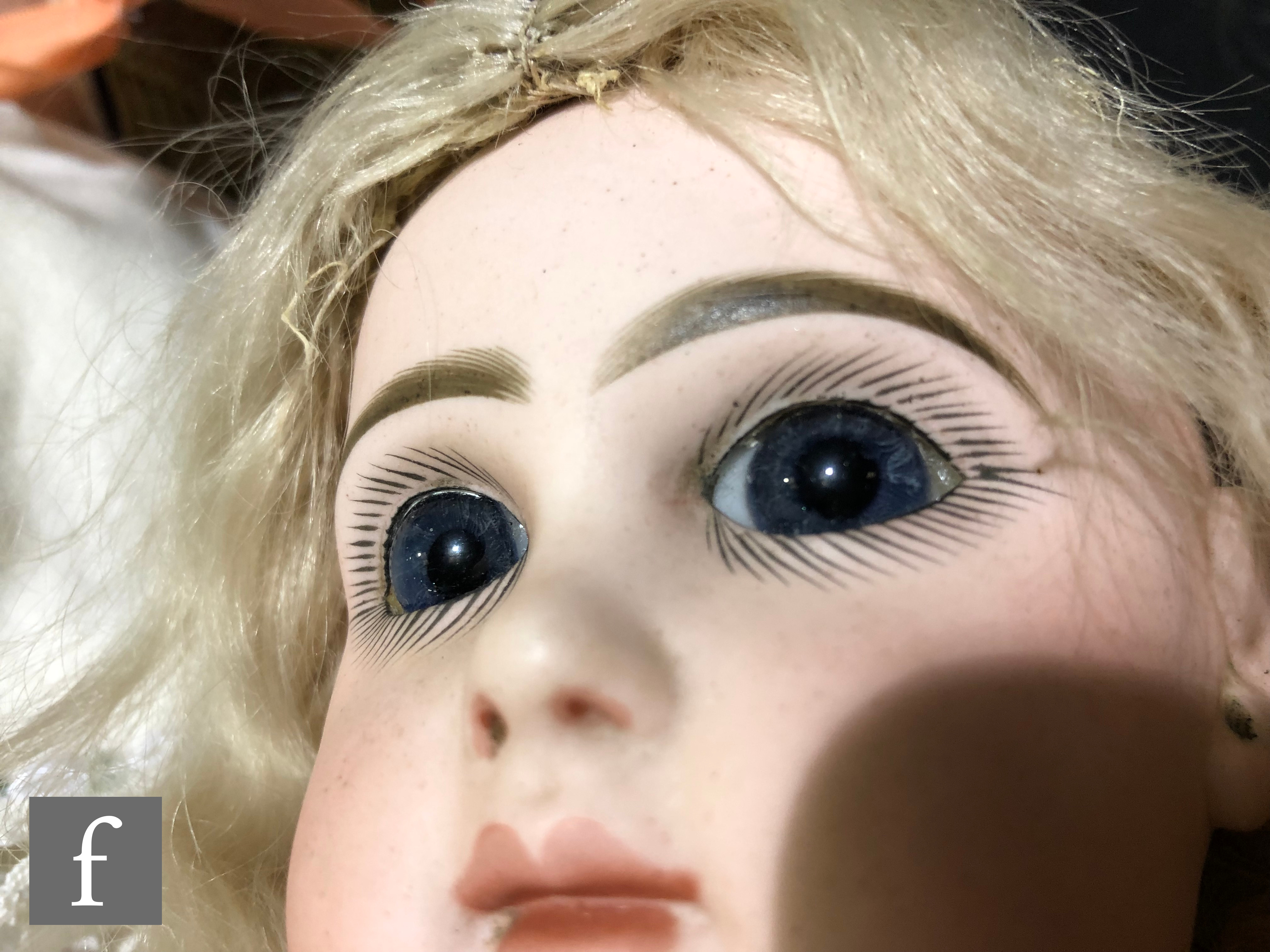 An unmarked French bisque head doll, probably Jumeau, with fixed blue paperweight eyes, painted - Image 5 of 7