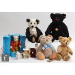 A collection of teddy bears, comprising four Steiff teddy bears with yellow tags comprising