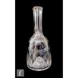 A 19th Century clear crystal Bitters bottle of mallet form with printie cut decoration and slice cut