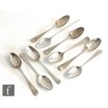 An 18th Century mote spoon with four 18th Century scroll back tea spoons and a further four 18th