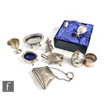 A parcel lot of assorted hallmarked silver items to include a three piece cruet, napkin rings, egg