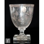 An 18th Century rummer circa 1780, the cup form bowl engraved with a lambrequin border and floral