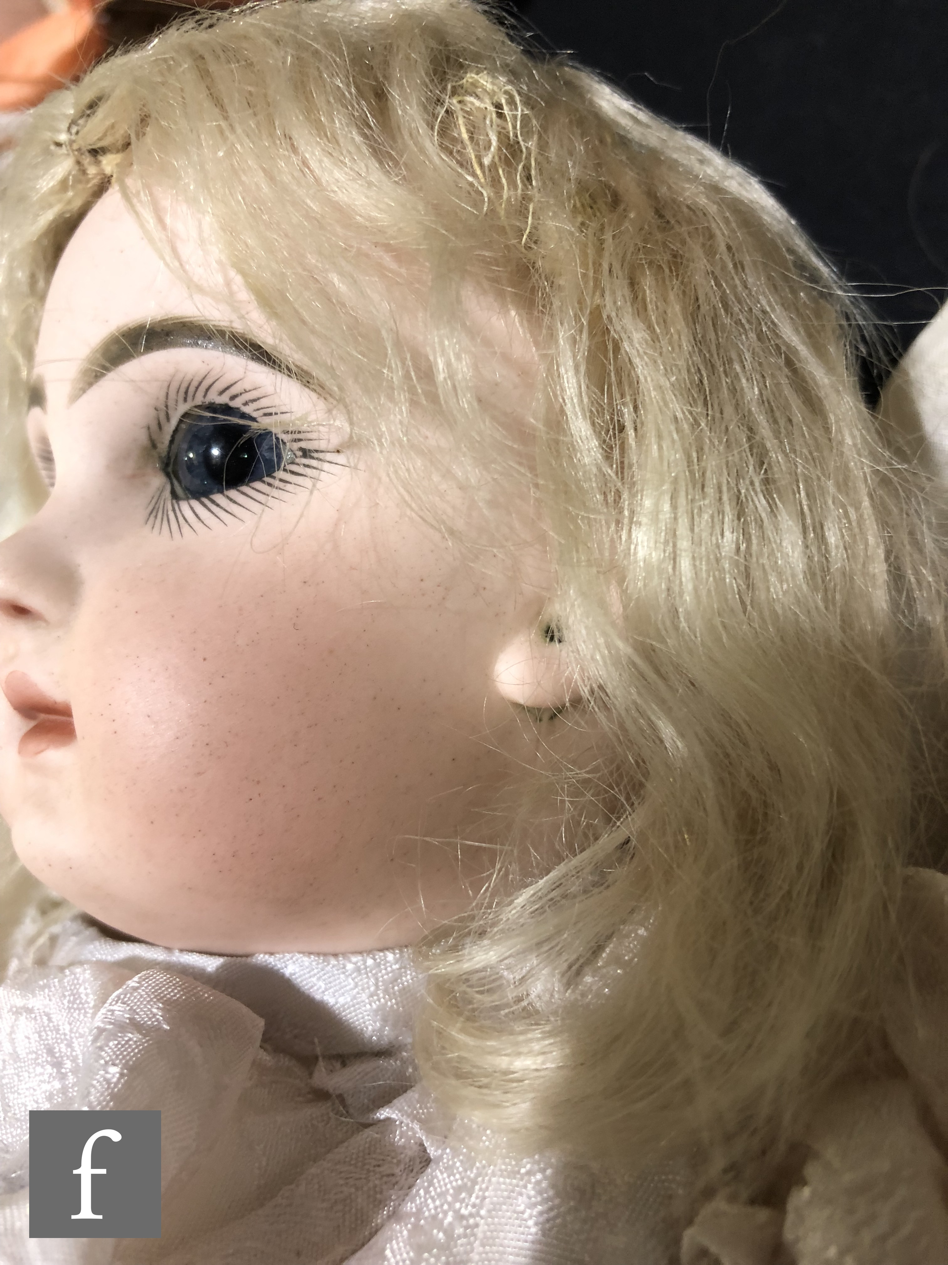 An unmarked French bisque head doll, probably Jumeau, with fixed blue paperweight eyes, painted - Image 2 of 7
