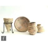 A collection of Indus Valley pottery items, (Circa 3rd millennium BC), to include a footed dish with