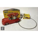A 1950s German Distler Electro Matic 7500 tinplate battery operated model of a Porsche 356, finished
