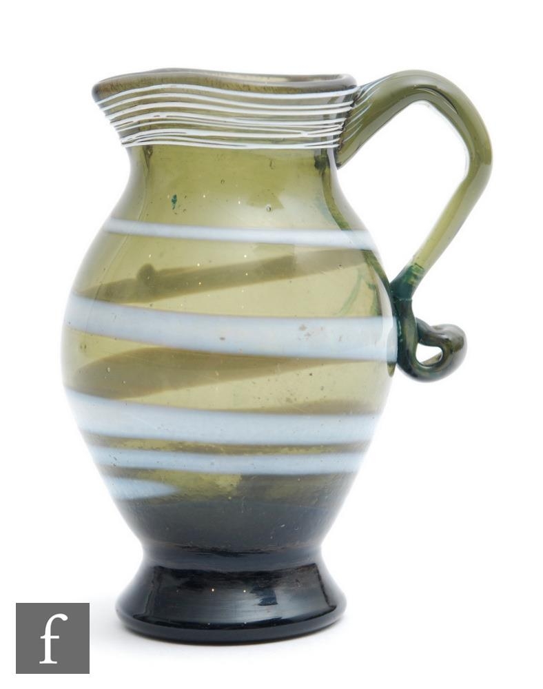 A late 18th Century jug circa 1780, of footed ovoid form with flared neck decorated with an opal