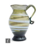 A late 18th Century jug circa 1780, of footed ovoid form with flared neck decorated with an opal