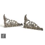 A pair of Victorian hallmarked silver menu holders with pierced foliate decoration around central