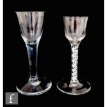 An 18th Century drinking glass circa 1765, the ogee bowl raised to a double series opaque twist stem