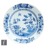 A Chinese 19th Century blue and white charger, the central field with duck before formal fenced