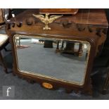 An early 20th Century mahogany framed bevel-cut wall mirror in the Georgian style,