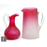 A late 19th Century Stourbridge ruby crackle glass jug, the swollen ovoid body rising to a tapered