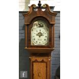 An early 19th Century oak and mahogany cross-banded longcase clock with a thirty hour movement,