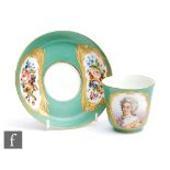 A 19th Century Sevres coffee cup and saucer, the can decorated with a hand painted portrait
