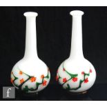 A pair of 20th Century Chinese Peking glass vases of footed globe and shaft form, decorated with