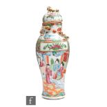 A late 19th Century Chinese Canton famille rose porcelain vase of ovoid form, surmounted by a