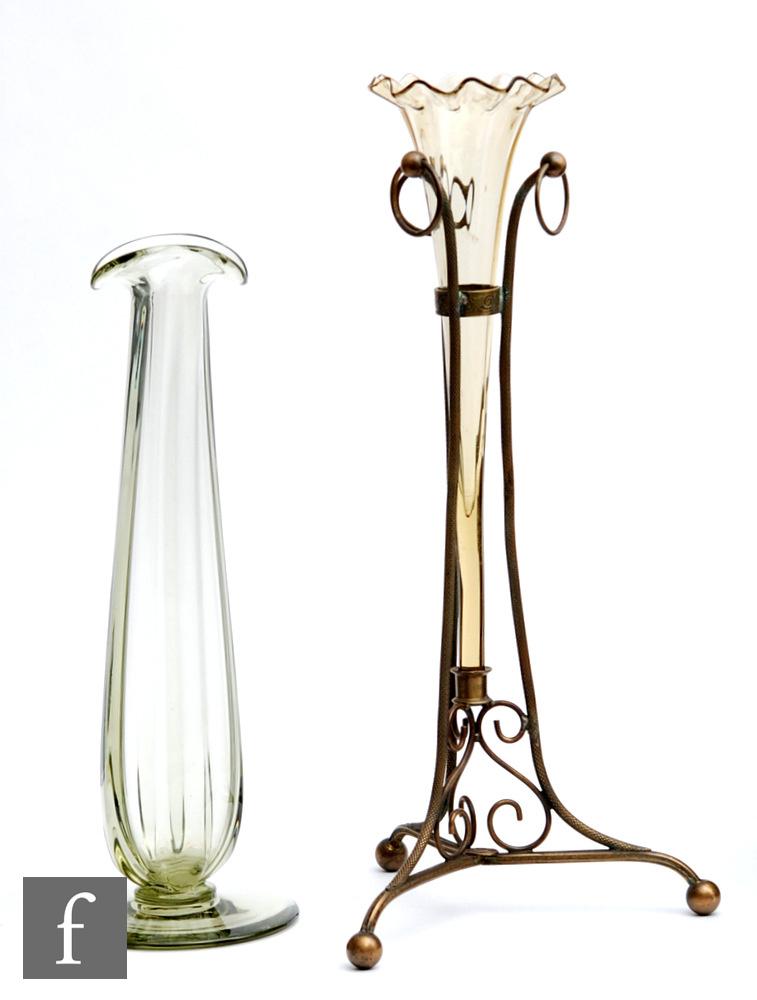 A late 19th Century posy vase of slender fluted form with a frill rim mounted to a scroll work brass