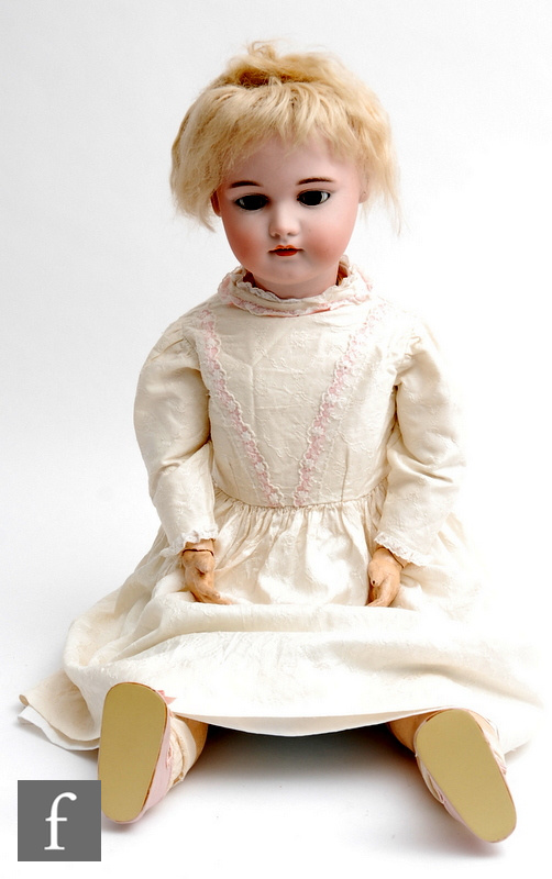 A late 19th Century Simon and Halbig bisque socket head doll, head mould 1079, with sleeping brown