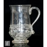 An early 18th Century tankard circa 1700, of baluster form with applied strap handle, with moulded