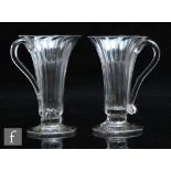 A pair of 18th Century jelly glasses circa 1750, each with flared round funnel bowl with panel
