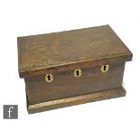 A 19th Century or earlier oak deed box with triple lock mechanism and later fitted interior, width