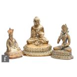 A collection of gilt metal Chinese/Tibetan figures, modelled as Shakyamuni Buddha, an Immortal