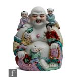 A 20th Century Chinese porcelain laughing Buddha figure, in seated position with protruding belly