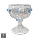 A late 19th Century clear crystal glass chalice with ovoid fluted bowl raised to a swept stem with