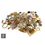 A parcel lot of assorted costume jewellery to include beads, brooches, bracelets, watches,