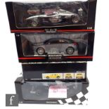 Four 1:18 scale Minichamps diecast model cars, to include 530 011804 D. Coulthard McLaren Mercedes