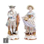 A pair of late 19th to early 20th Century Sitzendorf figures of flower sellers, she holding a basket