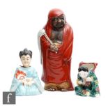 A collection of early to mid 20th Century Chinese and Japanese figures, to include a biscuit