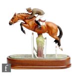 A limited edition Royal Worcester Equestrian Statuette of Merano and Cap. Raimondo d'Inzeo, numbered