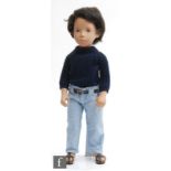 A Trendon Sasha 301 Gregor Dark Jeans doll, brown hair, wearing blue sweater, denim jeans with