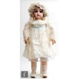 A late 19th Century Jumeau bisque socket head doll, with fixed paperweight blue eyes, closed