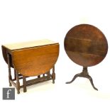 A 19th Century circular oak tripod occasional table on splayed legs, diameter 74cm and a 1930s