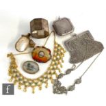 A small parcel lot of assorted items, two brooches, a silver compact, napkin ring, evening purse,