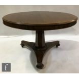 A Victorian mahogany tilt top circular breakfast table on tapering octagonal pedestal and tricorn