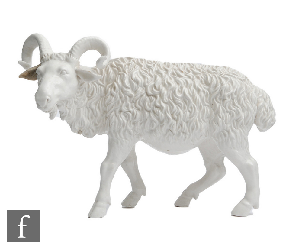 An early 20th Century German blanc de chine model of a goat, unmarked, length 24cm, restored.